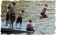 Boy Jumping Off Raft photo courtesy of the Abington Mariner
